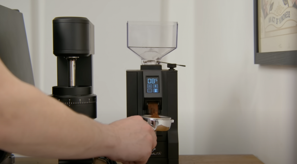 espresso coffee machine - grind - coffee beans - man making coffee